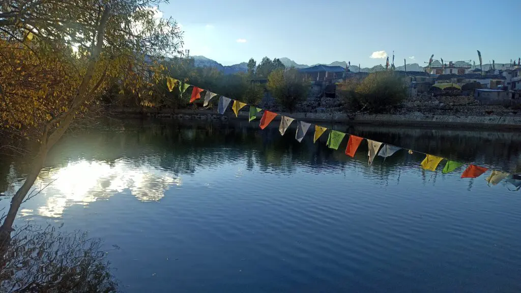 evening view of nako lake and flags of prayer