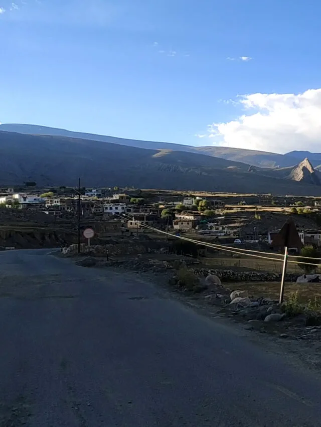 view of a small village in leh mountains blue sky
