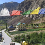 view of small village in mountains jispa Buddhist prayer flags