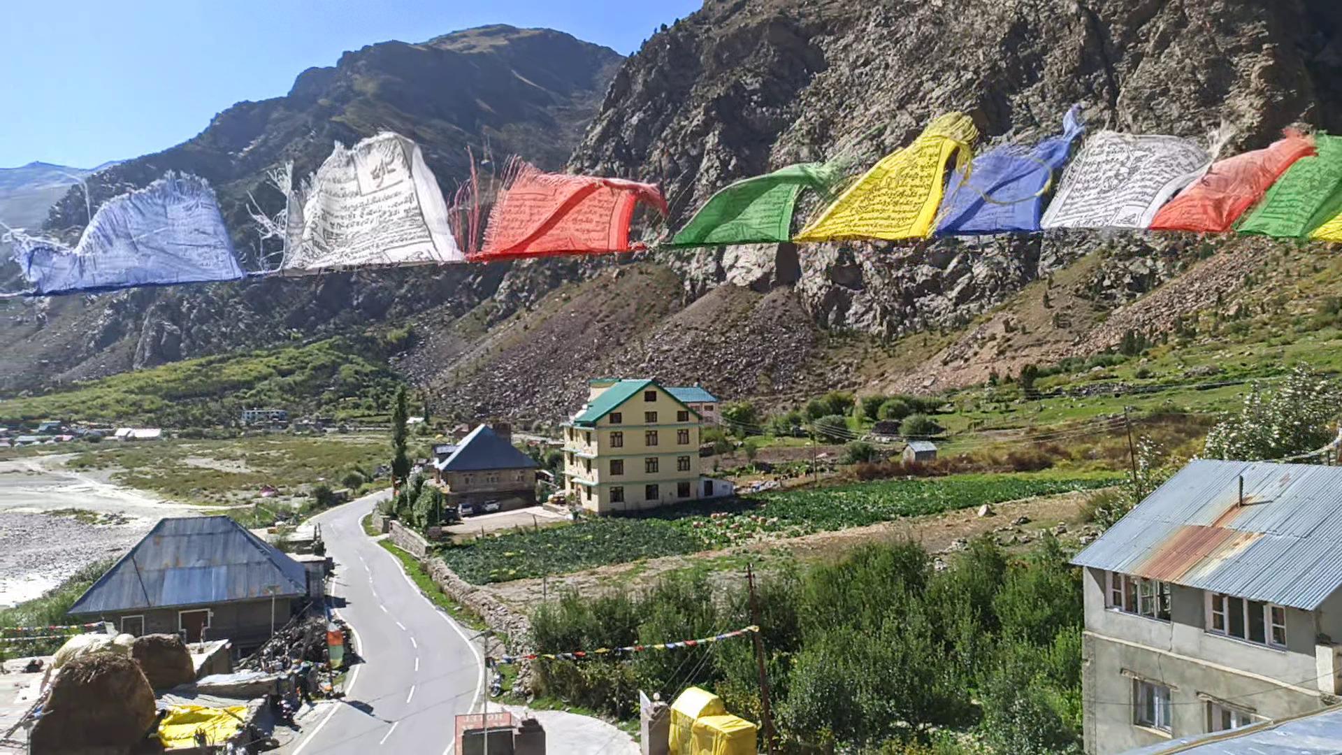 view of small village in mountains jispa Buddhist prayer flags