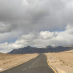moray plains road in mountains cloudy sky and well paved road