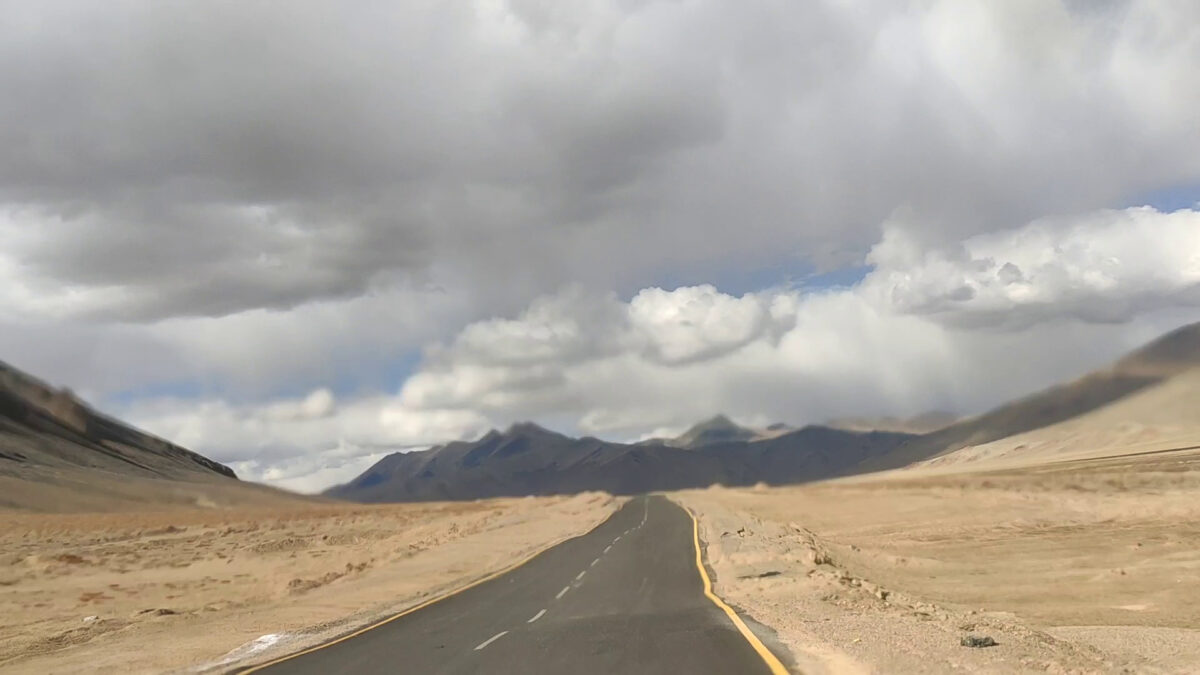 moray plains road in mountains cloudy sky and well paved road