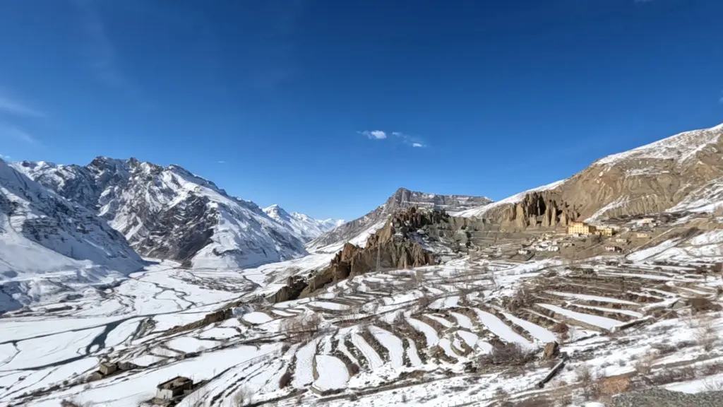 view of snow covered dhankar fort and monastery in winter spiti valley