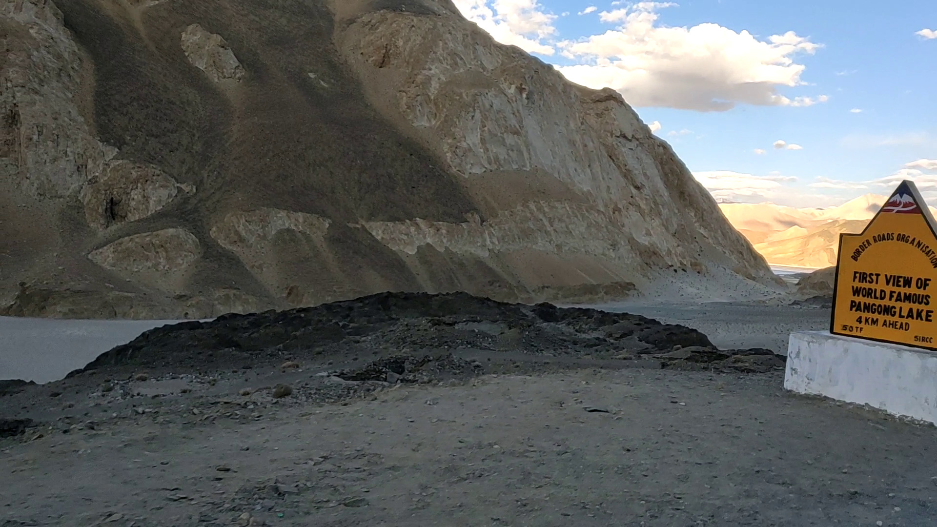 showcasing first vies of pangong lake mountains clear sky