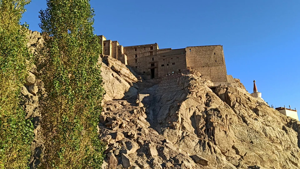 leh palace on a mountain in leh ladakh complete travel guide to leh 2023 banner