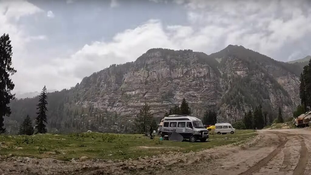 lush green meadows mountains view of sethan village in Places To Visit Near Manali