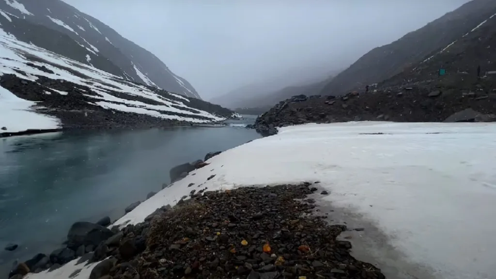 snow covered bhaga river in sissu village in manali