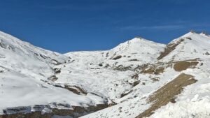 winter view of snow covered kibber village and road