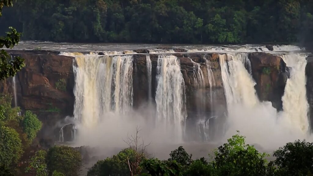 water fall in dense forest in thrissur in kerala