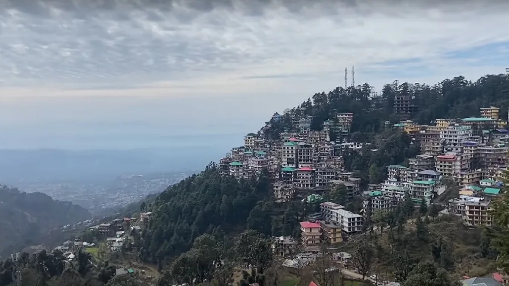 view of mcleodganj town green mountains blue sky
