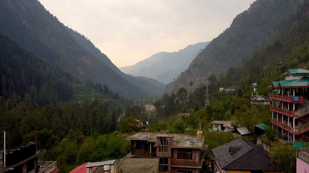 lush green mountains blue sky in evening a view from chalal village near kasol