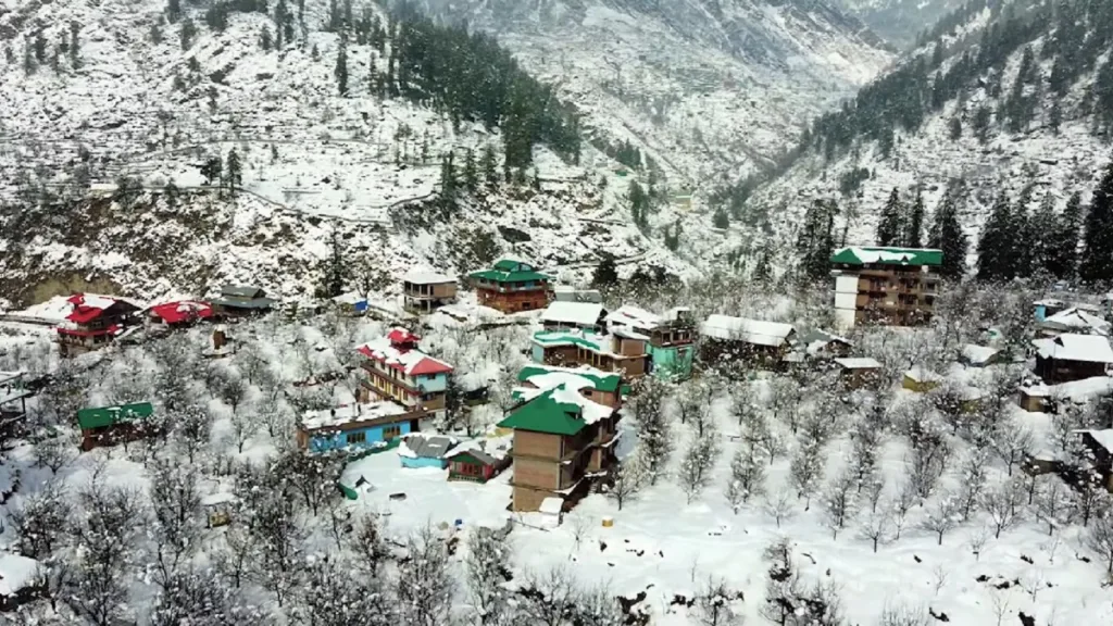 winter view of houses covered in snow in tosh village near kasol