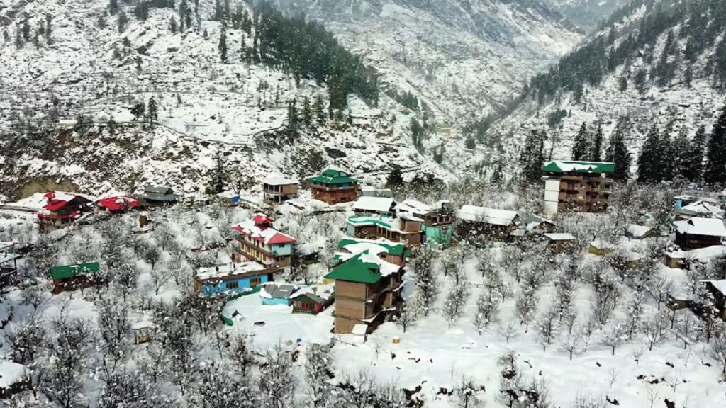 winter view of houses covered in snow in tosh village near kasol