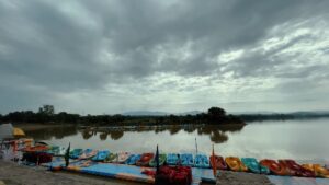 evening view of sukhna lake clouds in sky boats in chandigarh the city beautiful