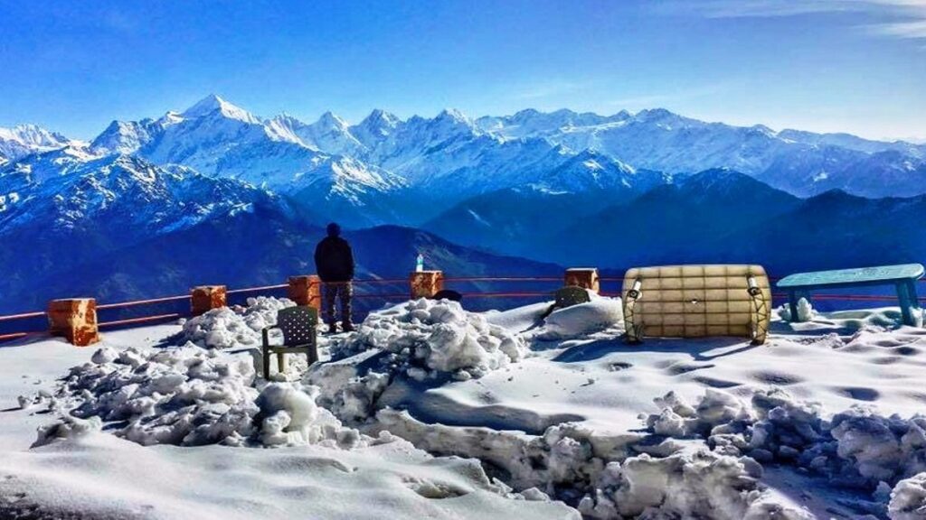 snow covered Dhanaulti in winters, uttarakhand, blue sky